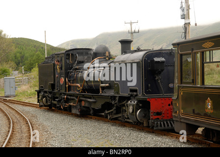 Beyer-Garratt locomotive of the Welsh Highland Railway leaving Rhyd Ddu station, snowdonia, wales Stock Photo