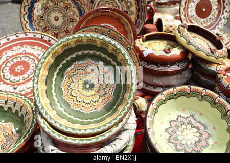 Glazed collection of stoneware on display at the pottery craft fair (Keramicke trhy) in Pezinok, Slovakia. Stock Photo
