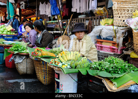 Thai woman selling fruits and vegetables in a street in Chiang Mai ...
