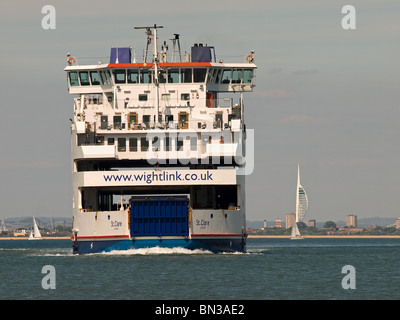Wightlink's car ferry St Clare approaching Fishbourne Isle of Wight UK with the Spinnaker Tower of Portsmouth in the background Stock Photo
