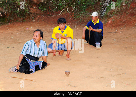 Hmong people playing top spinning during a tournament  in Ban Pha-nok-kok village, near Chiang Mai, Thailand, Asia Stock Photo