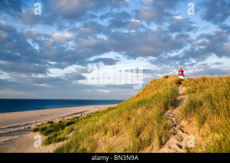 Dunes at a coast, lighthouse List-Ost in the background, Ellenbogen, Sylt, Germany Stock Photo