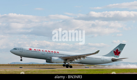 An Air Canada Airbus A330-300 landing at Vancouver International Airport (YVR). Stock Photo