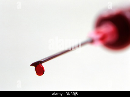 Close-up of blood drop on needle Stock Photo