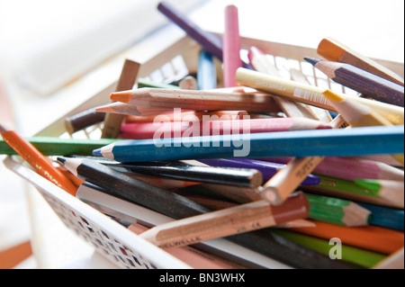 Coloured pencils in a basket, close-up Stock Photo