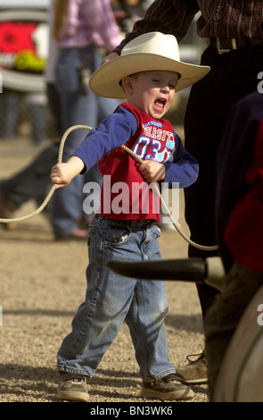 A young cowboy tries his hand at roping at the Fiesta de los Vaqueros, a rodeo in Tucson, Arizona, USA. Stock Photo