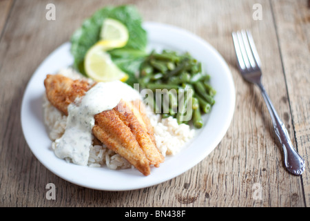 A French-style breading on local catfish served with green beans. Shot at The Crown Restaurant, Indianola, Mississippi. Stock Photo