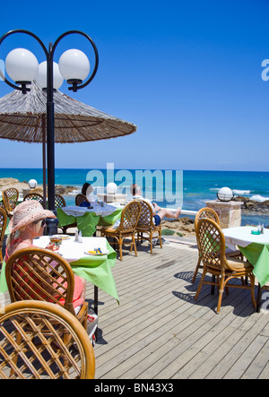 SEASIDE TAVERNA SCENE IN STALIS CRETE Stock Photo