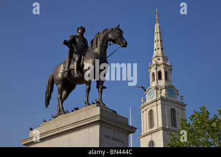 Statue of King George 1V in Trafalgar Square London, with St Martins in the Field Stock Photo