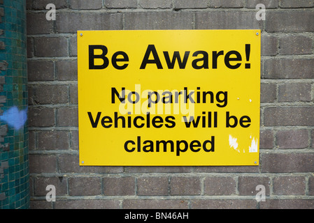 beware vehicle car clamping sign in london england uk Stock Photo