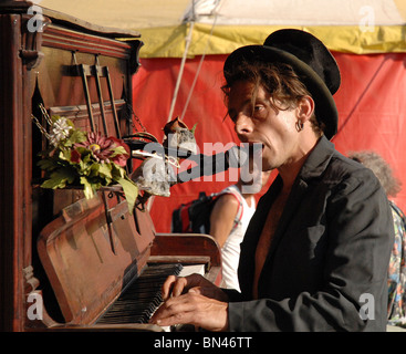 A piano player provides street entertainment Stock Photo