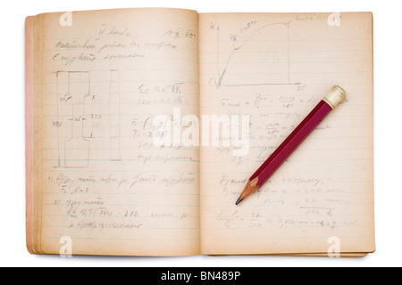 an open math notebook on white with pencil on it Stock Photo