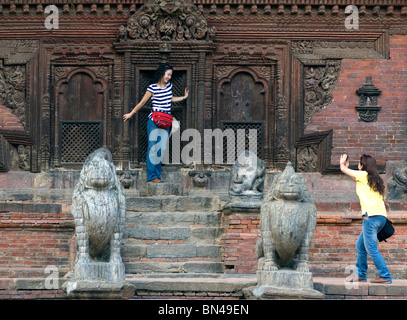 Japanese tourists take photographs at Vishnu Temple, in Durbar Square, Patan, Nepal. Stock Photo