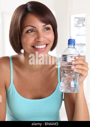 WOMAN WITH BOTTLE OF WATER Stock Photo