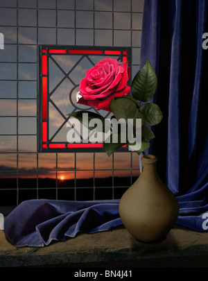 red rose and blue curtain on a window seal with sunset Stock Photo