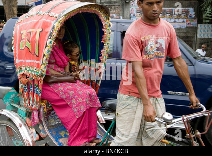 Street scene ; Man riding cycle rickshaw  ; Dhaka  ; Bangladesh Stock Photo