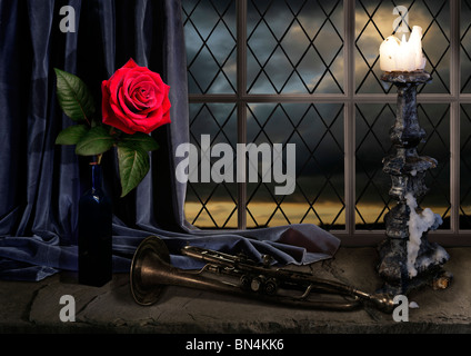 still life with rose candelabra and trumpet with sunset Stock Photo