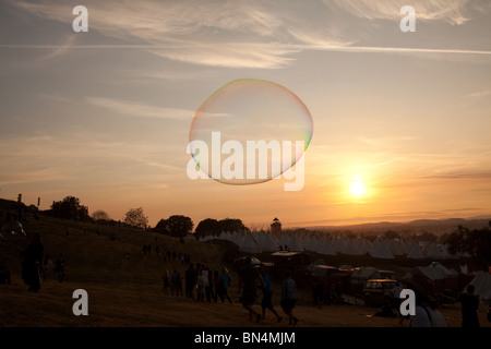 Large bubble photographed during the sunset at the Glastonbury Festival 2010 Stock Photo