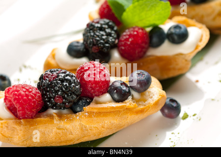 Two sweet tarts with fresh fruits Stock Photo