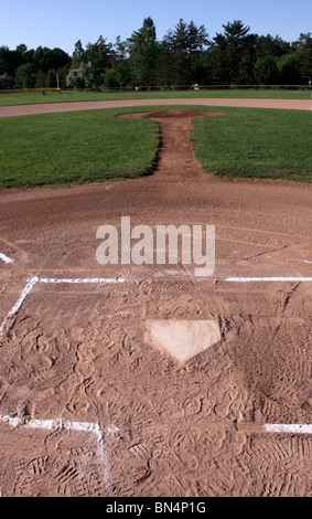 A view from behind home plate past the pitchers mound into the Stock