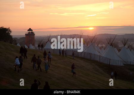 Sunset at the Glastonbury festival 2010, Photographed from Pennard Hill looking at the Park stage arena and ribbon tower Stock Photo