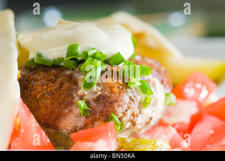 fresh traditional falafel wrap on pita bread with fresh chopped tomatoes Stock Photo