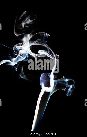 blue and white abstract and chaotic smoke on black background Stock Photo