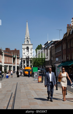 People walk along Market Street in Spitalfields, a shopping and market district in London. Stock Photo