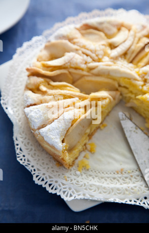 Italian Apple Pastry Cake, Breakfast with a book opened describing the French Provence. Stock Photo