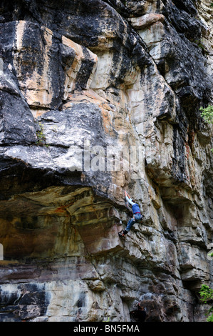 A rock climber maneuvering rocky cliff. Banff National Park, Alberta, Canada. Stock Photo