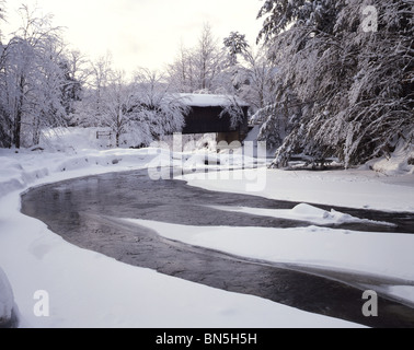 River and Covered Bridge in Winter, VT Stock Photo