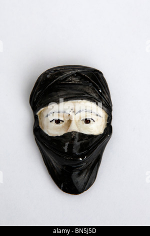A masked face represents an Arabic man. Stock Photo