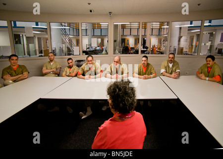 An civilian instructor conducts an anger management class with inmates of the Santa Ana, CA, city jail. MODEL RELEASE Stock Photo