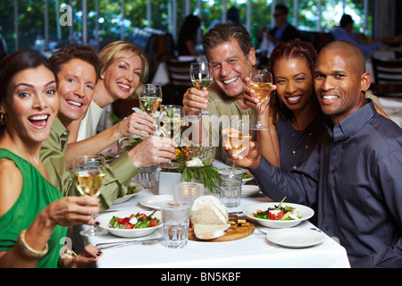 Friends having dinner in restaurant Stock Photo