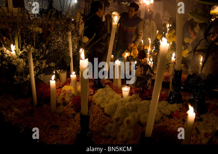 Tomb decorated with flowers and candles on the day of the dead in Mixquic, Mexico Stock Photo