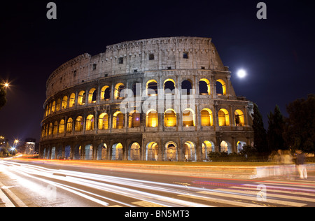 Colosseum at night with traffic trail, Rome, Italy Stock Photo