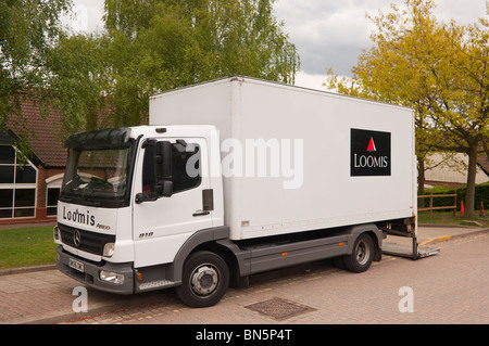 A Loomis security money managing van in the Uk Stock Photo