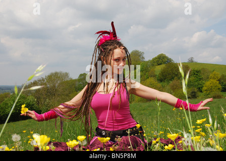 Pink fairy with dandelions Glastonbury Somerset UK Stock Photo
