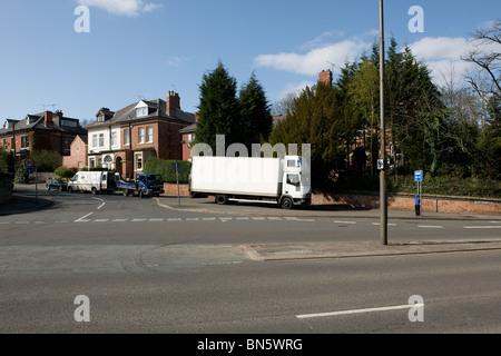 An white lorry parked on the pavement on the outskirts of Derby, Derbyshire, England Stock Photo