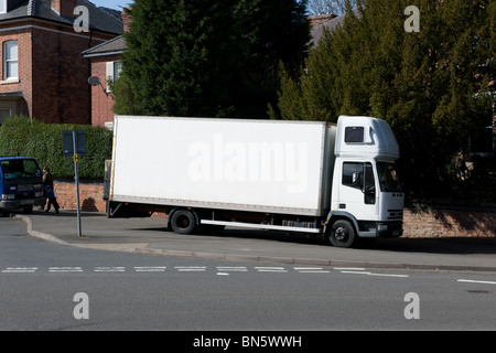 An white lorry parked on the pavement on the outskirts of Derby, Derbyshire, England Stock Photo