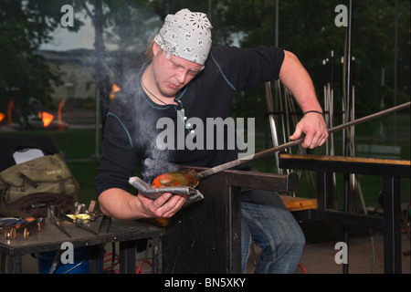 American Glassmith working with the hot glass pictures images photos photograph large high resolution close up in USA US horizontal hi-res Stock Photo