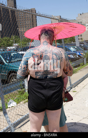 Man with ornate tattoos at the Mermaid Parade in Coney Island, Brooklyn, NY. Stock Photo