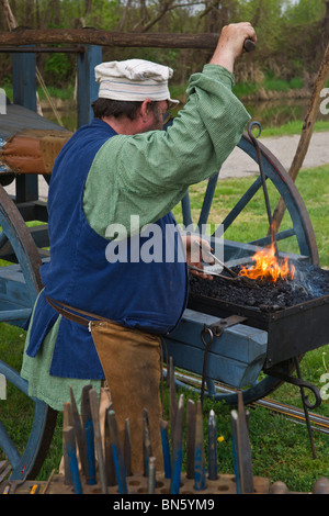 Tulip time festival Dutch Holland Michigan in USA  US XVIII century Dutch blacksmith dressed in traditional costume at work during trade fair hi-res Stock Photo