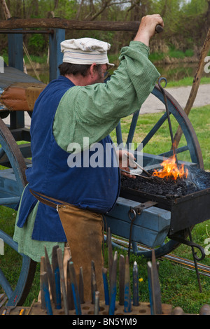 Tulip time festival Dutch Holland Michigan in USA  XVIII century Dutch blacksmith dressed in traditional costume at work during trade fair hi-res Stock Photo