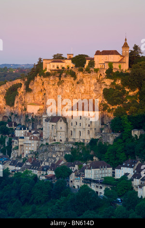 Warm sunset light illuminates the historic town of Rocamadour, Dordogne, France Stock Photo