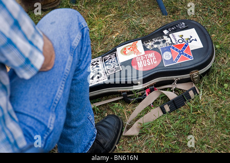 A fiddler sitting next to his violin case at the Smithville Jamboree of country music and bluegrass held annually in Tennessee. Stock Photo