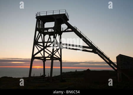 An old abandoned pit head winding gear at a tin mine in Botallack, Cornwall, UK. Stock Photo