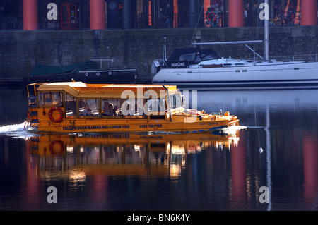 The Yellow Duckmarine in the Albert Dock , Liverpool. An amphibious vehicle giving  a city sightseeing tour of Liverpool. Stock Photo