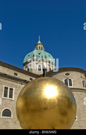 Giant golden ball monument at Kapitelplatz square in Salzburg (Austria) Stock Photo