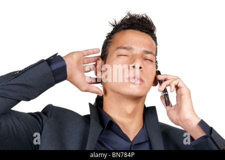 Worried young business man on a mobile phone. Stock Photo